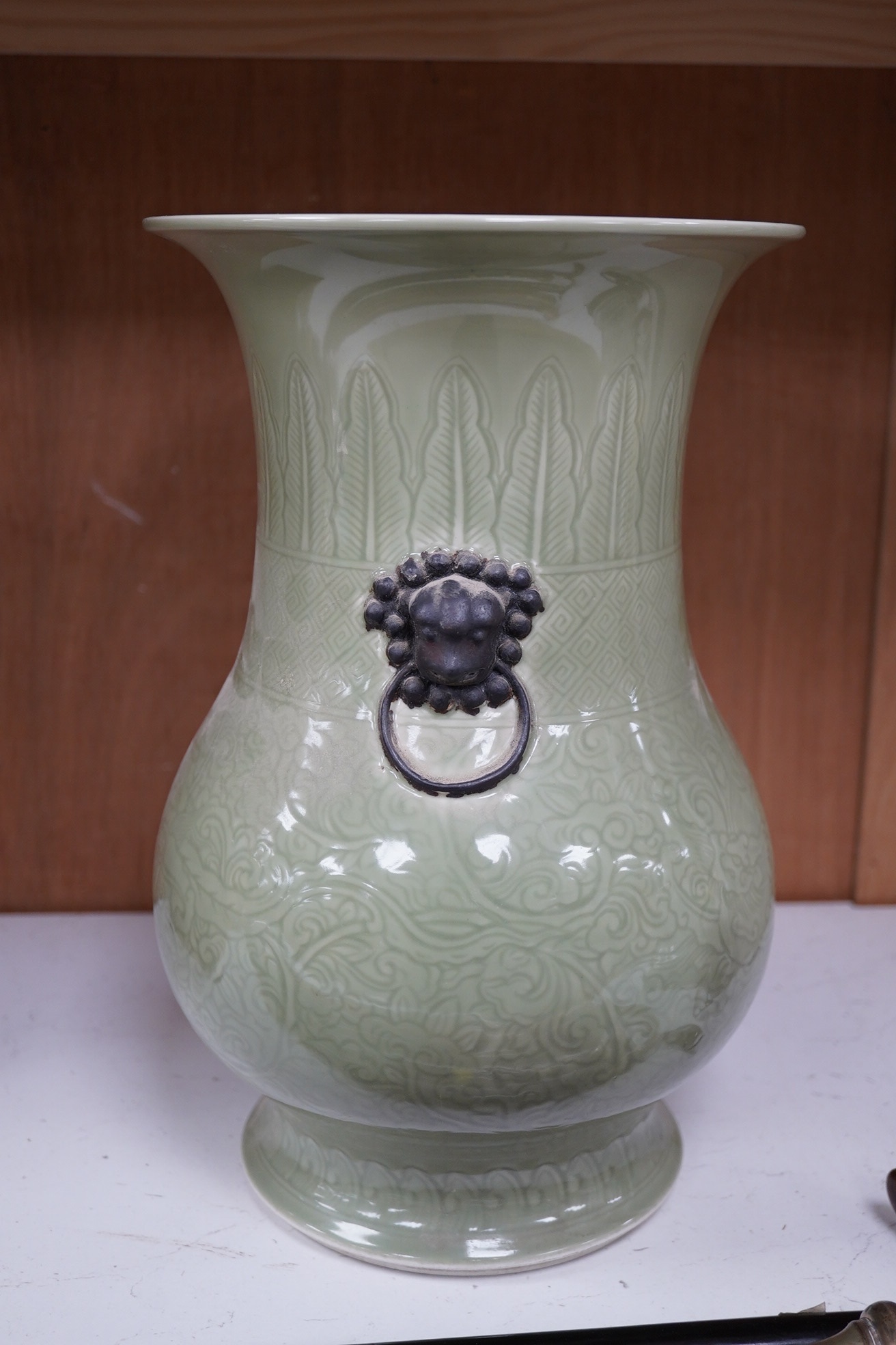 A Chinese carved celadon glazed vase, possibly Kangxi, 34cm high. Condition - good